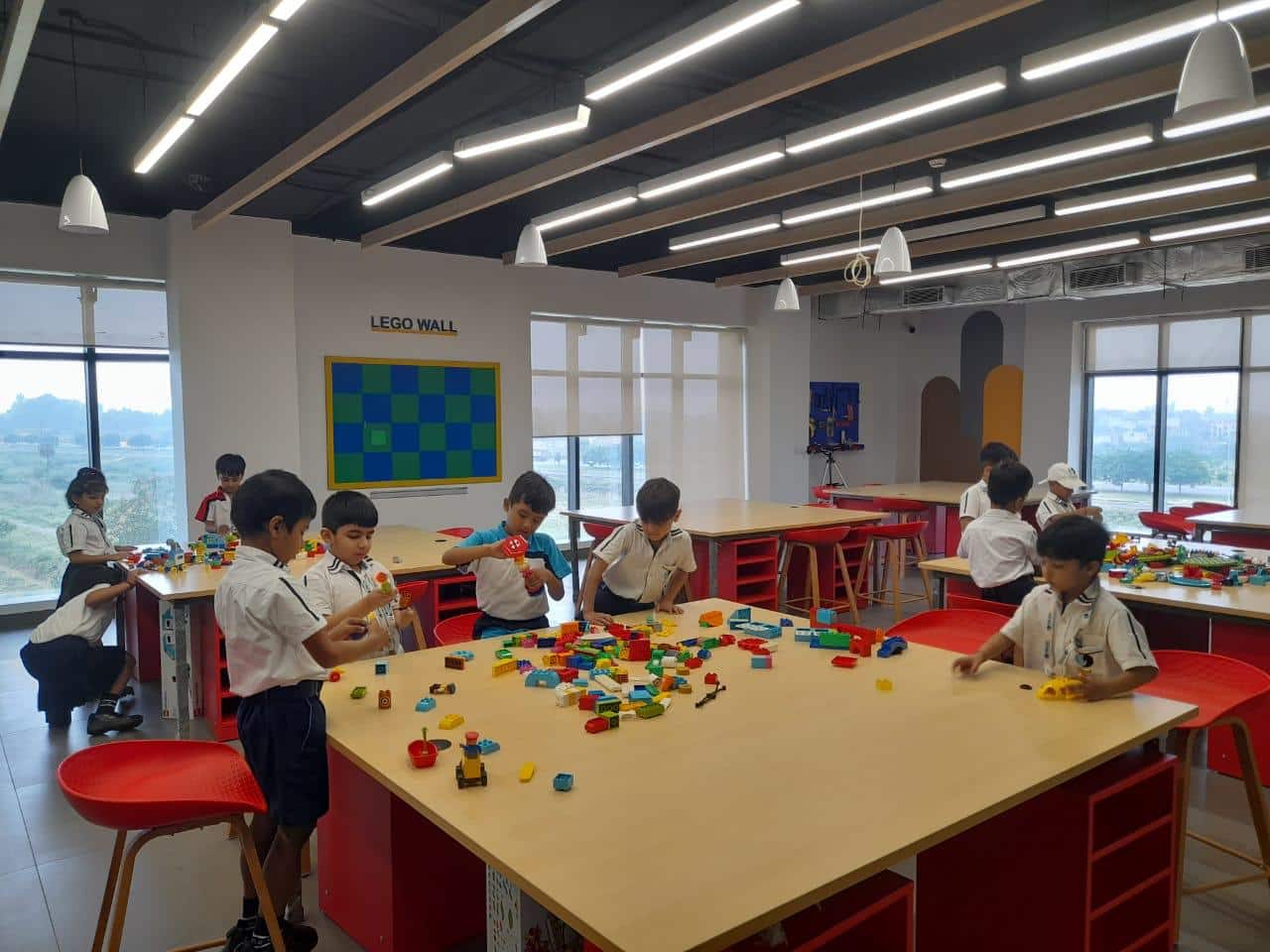 Students exploring STEM robotics kits in class