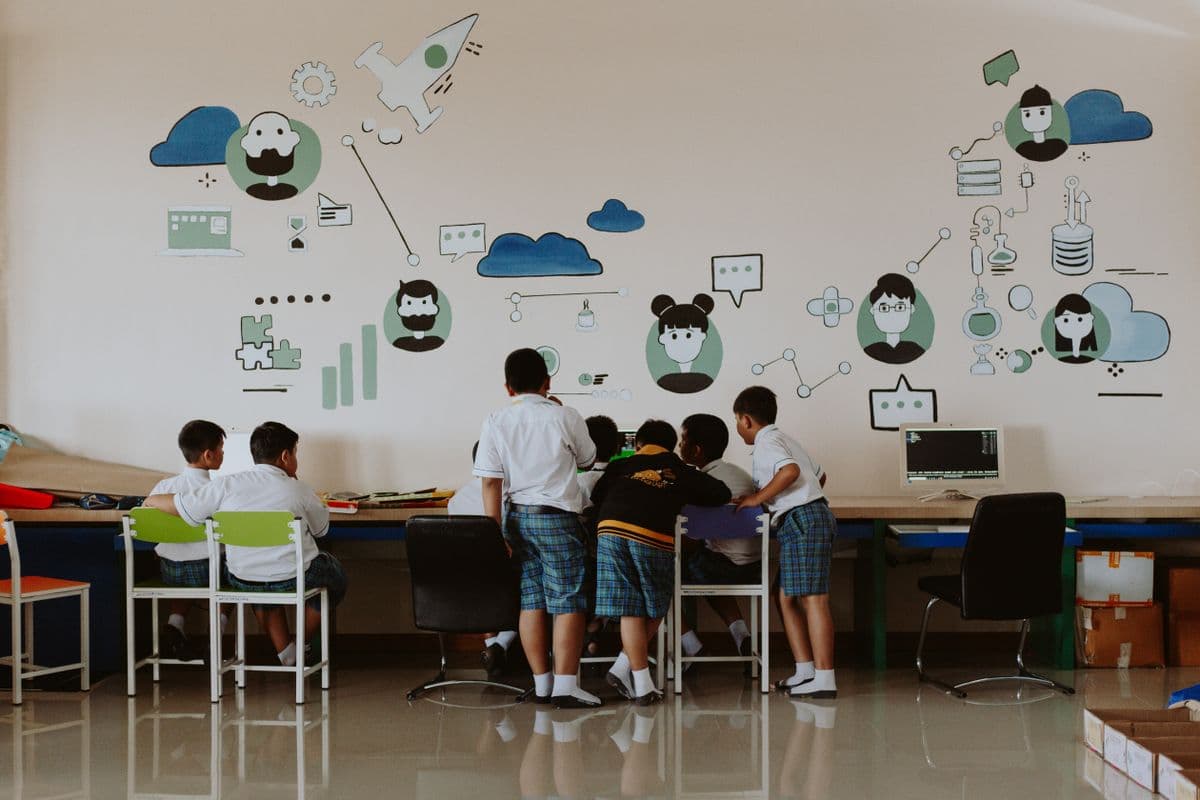 Students learning together inside a school computer lab