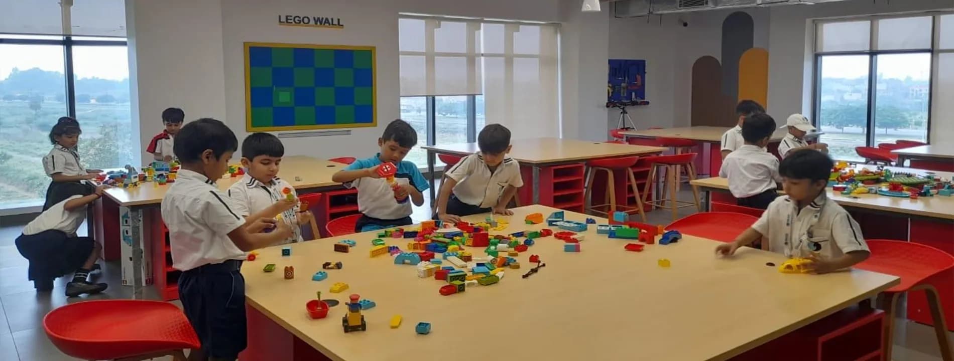 Students exploring practical science and robotics activities in a modern lab